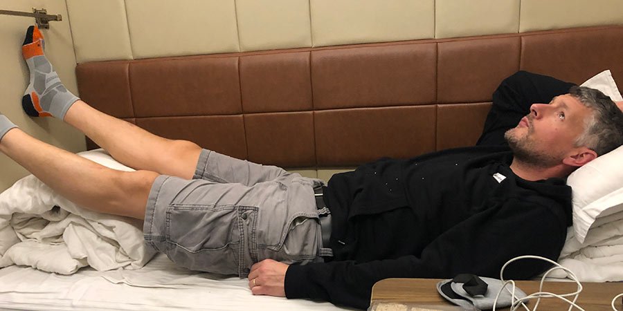 Rob is too tall for the sleeper cabins aboard the Reunification Express, but enjoys his stay anyway. 